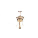 An Arts & Crafts style hammered brass hanging ceiling lantern of trumpet form with faux planished