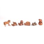 A group of six Japanese hardwood carved netsukes, variously formed as animals, the largest 7 cm