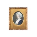 Early 19th-century school, a portrait miniature on ivory, a smartly dressed lady in a blue shawl,