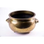 A large Chinese bronze censer, Qing, of circular form with everted rim, with applied lion mask
