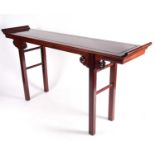 A long Chinese scroll table, 20th century, possibly huanghuali, with inlaid brass stringing and