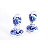A pair of Chinese blue & white baluster form candlesticks, ing, 20th century, painted with