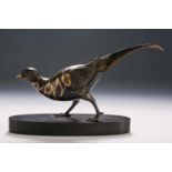 A patinated bronze pheasant, 20th century, the plumage heightened with gilding, on a polished