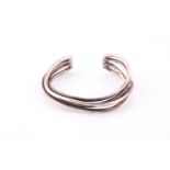 A bangle by Georg Jensen Composed of four rigid bars, signed, stamped 925, inner diameter 5.4cm,