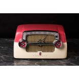 A Crosley E-15 vintage 'Buick Dashboard' radio, circa 1953, with two tone pink and cream bakelite