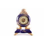A French gilt spelter and porcelain mantel clock, late 19th century, with gilt foliate decoration on