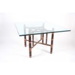 A McGuire bamboo table base with heavy glass top, 117 cm square by 74 cm high.