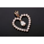 A yellow gold and diamond heart-shaped pendant, suspended with a mixed pear-cut diamond of