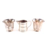 A pair of Edwardian silver beakers, London 1902 by Horace Woodward and Co, of lobed quatrefoil form,