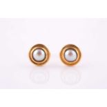 A pair of pearl earrings by Gucci Each 5.6mm half-pearl of white tint in closed-back setting