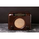 A Bush DAC 90 A vintage valve radio, circa 1950's, in a walnut finish bakelite case, 30cm wide, 23cm