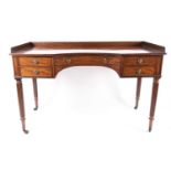 A Regency Gillows of Lancaster mahogany kneehole library/ dressing table. With curved and recessed