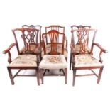 A pair of Chippendale style mahogany open arm carver chairs and a pair of dining chairs, all