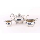 A George III three-piece silver teaset, London 1817 (makers indistinct)m comprising a teapot,