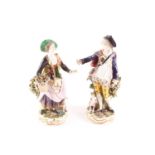A pair of 19th century Chelsea-style porcelain figures, a gentleman and companion, painted in