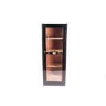 A large freestanding cigar humidor / cabinet, with glazed door and internal wooden shelving, 150