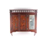 An Aesthetic Movement wall mounted walnut cabinet, circa 1890, the gallery with turned spindles