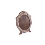 An Edward VII silver shield-shape picture frame, Birmingham 1909 (maker indistinct), of art