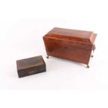 An early 19th century mahogany tea caddy, crossbanded in rosewood and with boxwood stringing, the