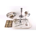 A collection of Silver plated wares including rectangular moulded tray, toast racks, candlestick,