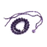 Amethyst necklace, line of compressed oval beads spaced with diamond pavé set spherical links,