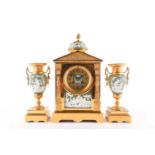 A late 19th/early 20th -century Japy Freres three-piece gilt brass clock garniture. The
