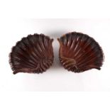 A pair of carved wood clam shells, early 20th century, possibly Irish, 40.5cm diameter.Condition