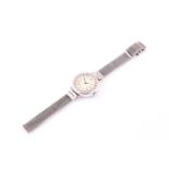 Lady's platinum and diamond cocktail watch, cream dial with Roman numerals, diamond set bezel, Swiss