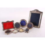 A collection of nine 20th century silver-mounted easel photograph frames of varying design. 24.5