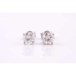 A pair of diamond earstuds Each brilliant-cut diamond within a four-claw setting, approximately 1.