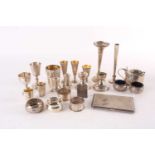 A mixed group of small silver and white metal items, to include cruets, spill vases, tots,