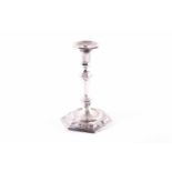 A George I period silver taperstick, London 1722 (maker indistinct), of hexagonal form with