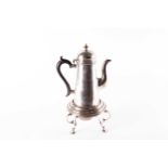 An Edwardian silver coffee pot on stand, with burner, Chester 1905 by George Nathan and Ridley