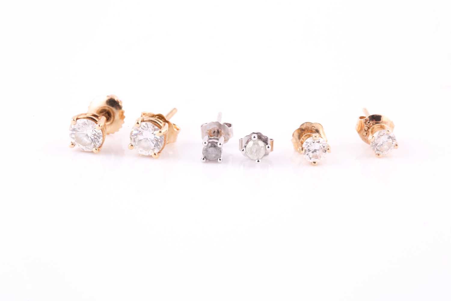 Three pairs of diamond ear studs, the largest pair estimated total diamond weight 0.9 carats, 2.7