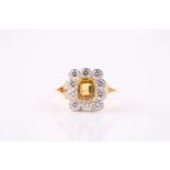 A yellow sapphire and diamond cluster ring, the 6 x 5mm vivid yellow sapphire within a millegrain