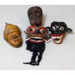 Vier div. Masken. Holz, geschnitzt und farbig gefasst, einmal Bart aus Wolle oder Baum