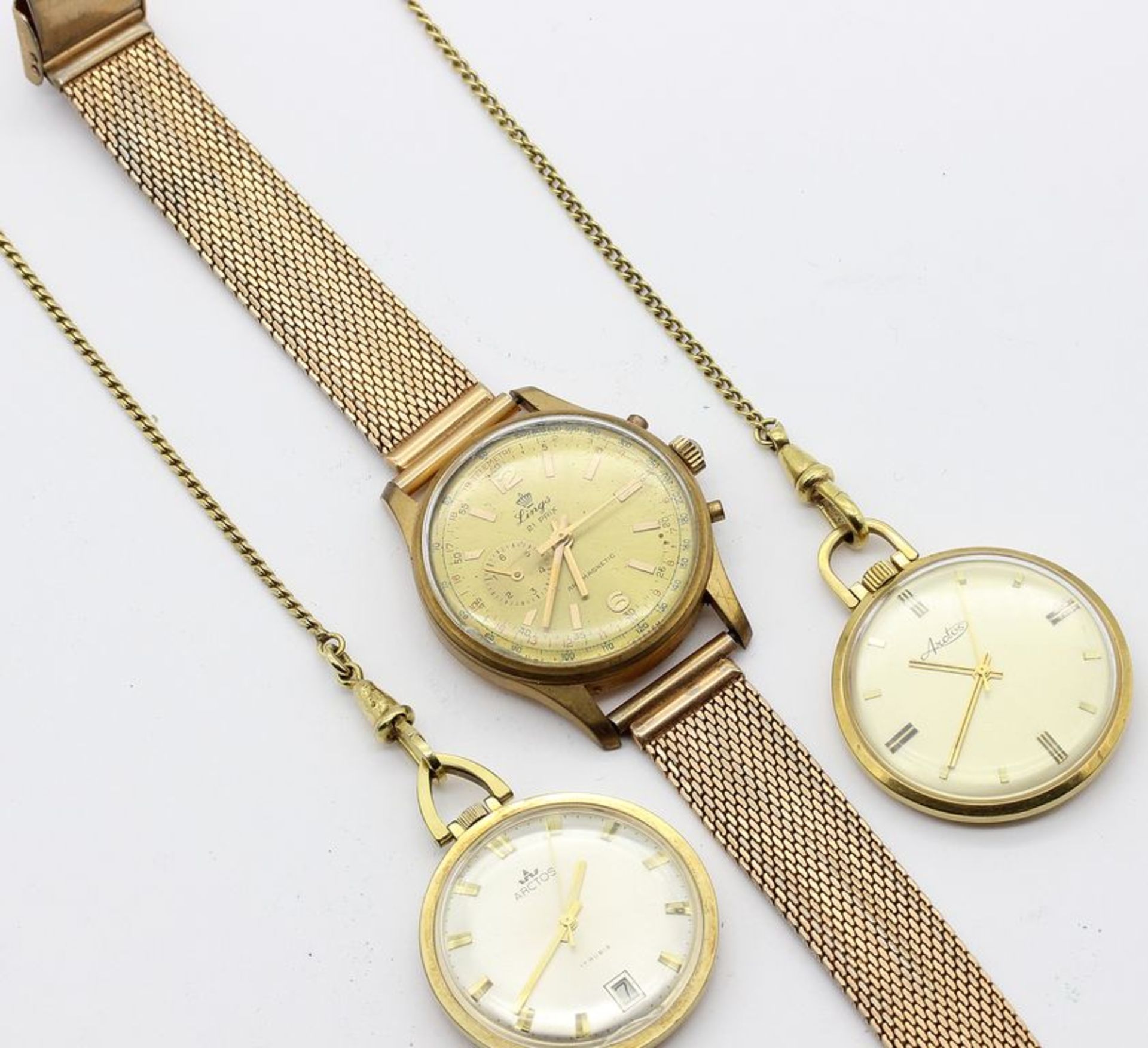 Herrenarmbanduhr und 2 Frackuhren an Uhrenketten. Doublé. a) Armbanduhr "Lings" mit S