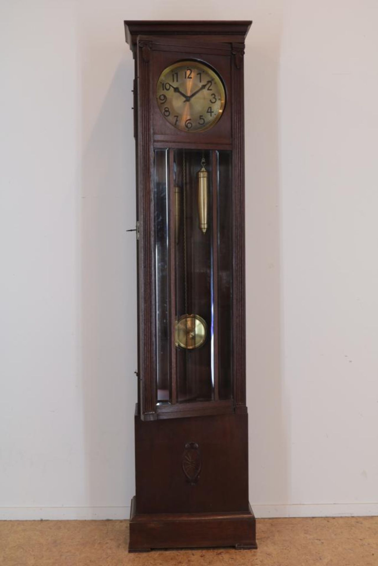 Staand horloge in eiken kast