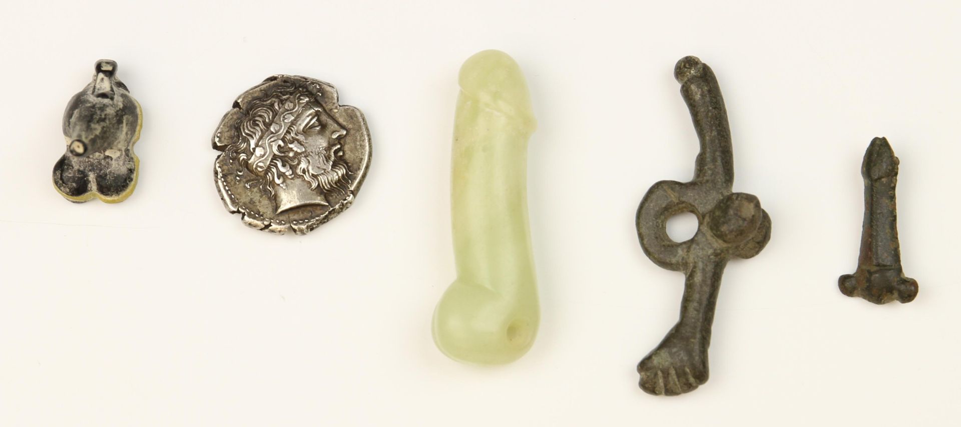 An antique bronze double phallus, possibly Roman and an antique small phallus amulet