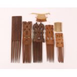 Surinam, collection of four wooden carved hair combs. Herewith two small hair combs.