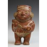 Peru, Moche, a painted terracotta figure cup, 100-750