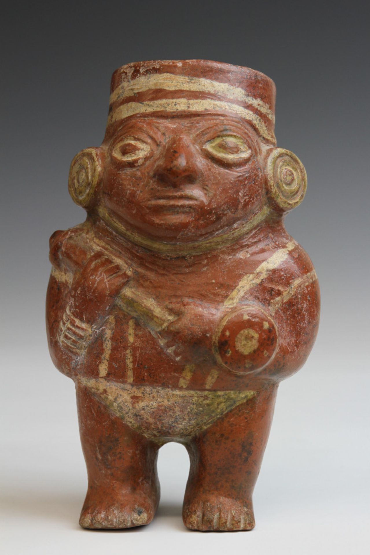 Peru, Moche, a painted terracotta figure cup, 100-750