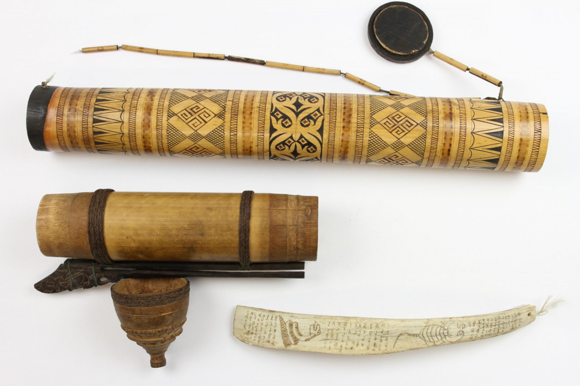 A Dayak bamboo quiver, a Sulawesi bamboo decorated container and a Batak, carved water buffaloo manu - Image 7 of 8