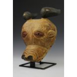 An West African wooden mask of a bull,