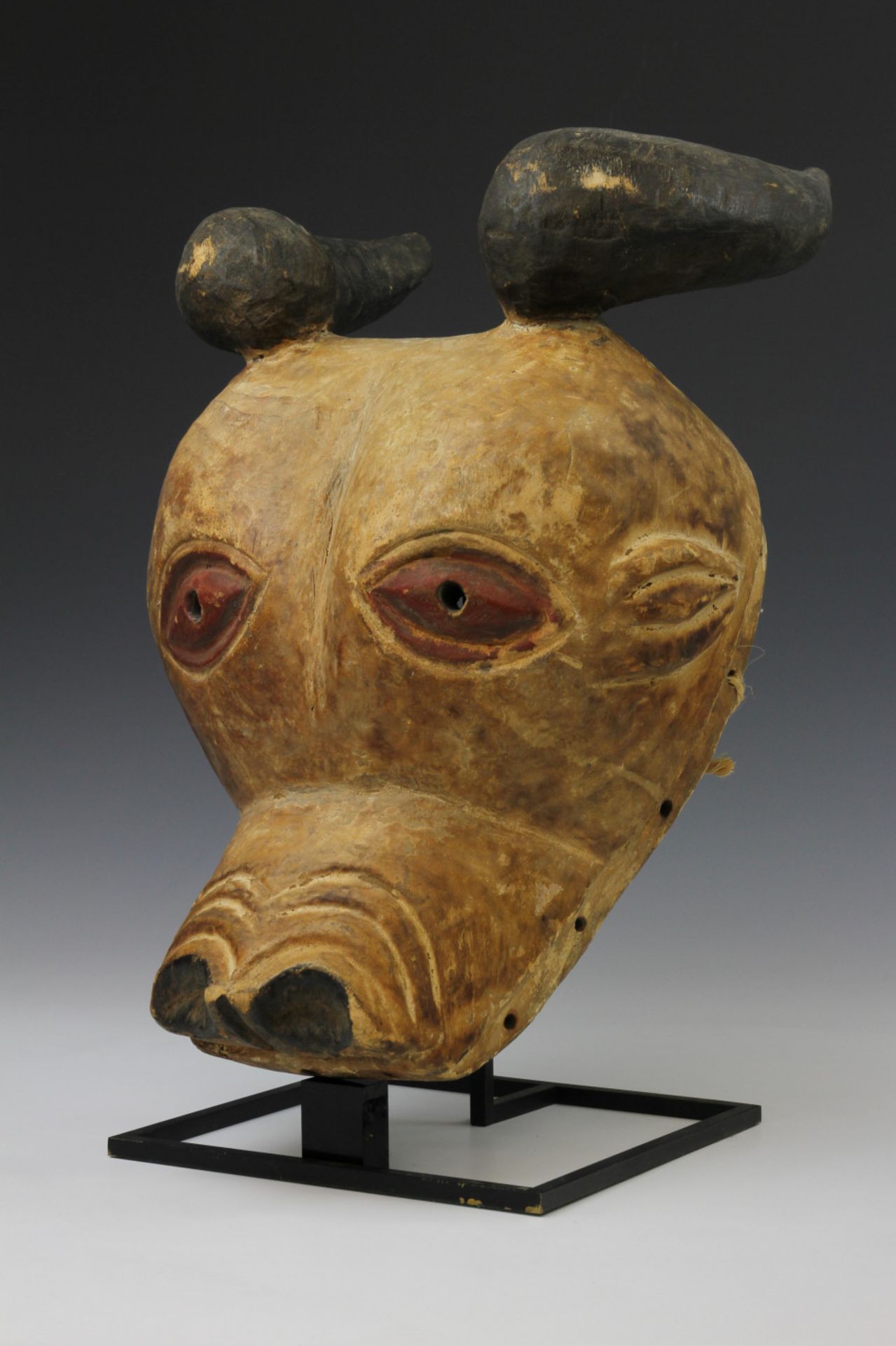 An West African wooden mask of a bull,