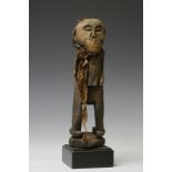 A African carved wooden power figure, possibly Nigeria-Cameroon