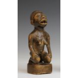 DRC., Vili, a kneeling female figure.