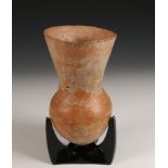 Hellenistic terracotta vase, 5th-4th century and a Roman fibula, 2nd century.