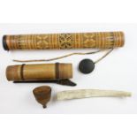 A Dayak bamboo quiver, a Sulawesi bamboo decorated container and a Batak, carved water buffaloo manu