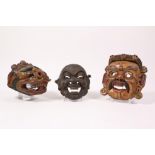 Tibet, collection of four decorative masks and Japan, one mask